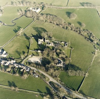 Oblique aerial view centred on the abbey and manse, taken from the W.