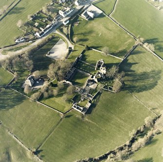 Oblique aerial view centred on the abbey and manse, taken from the SSE.