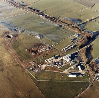 Oblique aerial view of Kirkcudbright training area centred on Girdstingwood Headquarters, taken from the SE.