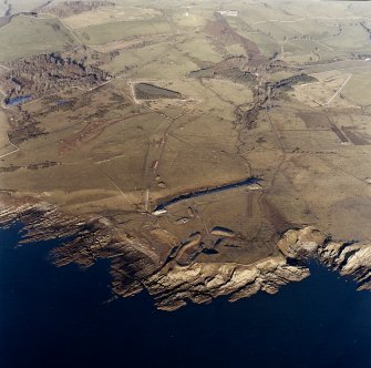 Oblique aerial view of Gypsy Point centred on the remains of field banks and rig, with firing point and the site of Balmae House adjacent, taken from the SSW.