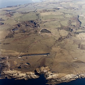 Oblique aerial view of Gypsy Point centred on the remains of field banks and rig, with firing point and the site of Balmae House adjacent, taken from the SSE.