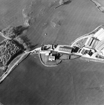 Oblique aerial view centred on the farmstead with the site of the well adjacent, taken from the SSW