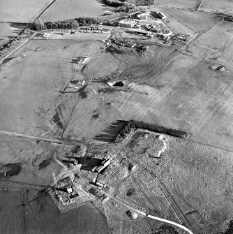 Oblique aerial view of Kirkcudbright training area centred on Girdstingwood Headquarters and firing position with buildings adjacent, taken from the W.