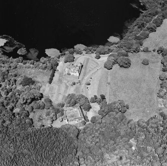 Oblique aerial view from SSW, centred on the tower-house.