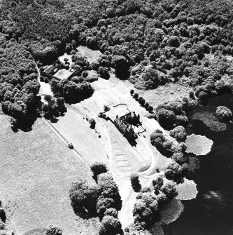 Oblique aerial view from ENE, centred on the tower-house.