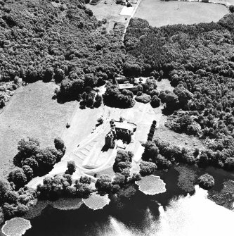 Oblique aerial view from NNE, centred on the tower-house.