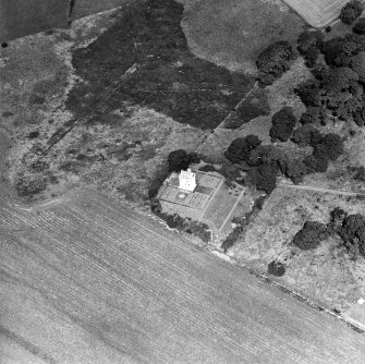 Oblique aerial view centred on the tower-house, taken from the S.