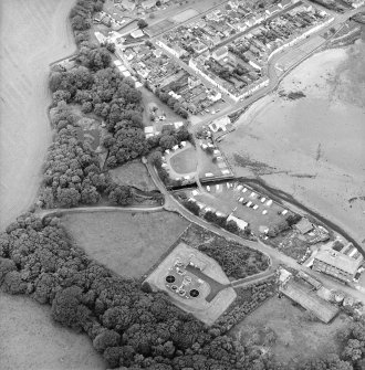 Oblique aerial view of the village, centred on the village hall, taken from the SE.