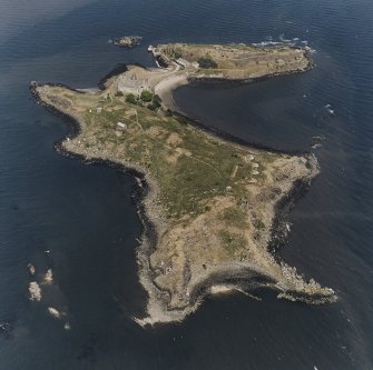 Inchcolm Island, oblique aerial view, taken from the W, showing a general view of the island, with Inchcolm Abbey and four coastal batteries visible.