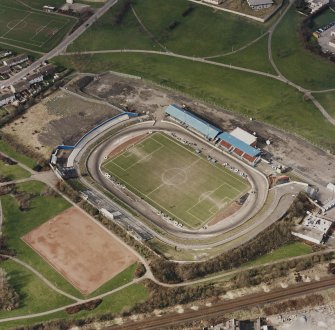 Oblique aerial view of Cowdenbeath centred on the Central Park football ground, taken from the SE.