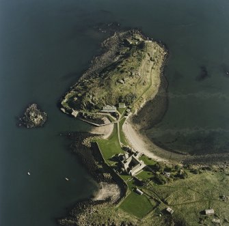 Oblique aerial view centred on the coast batteries with abbey adjacent, taken from the NW.