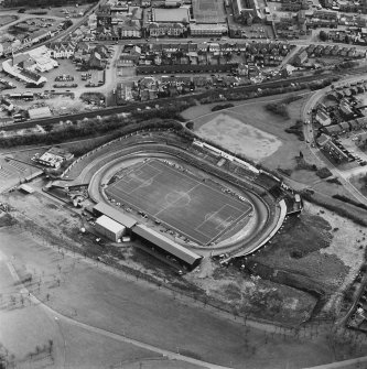 Oblique aerial view of Cowdenbeath centred on the Central Park football ground, taken from the NW.