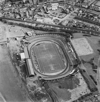 Oblique aerial view of Cowdenbeath centred on the Central Park football ground, taken from the W.