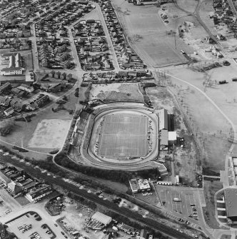 Oblique aerial view of Cowdenbeath centred on the Central Park football ground, taken from the ENE.