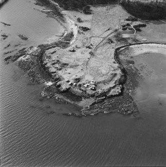 Oblique aerial view of Charles Hill centred on a coast battery with a ferry-house cellar adjacent, taken from the E.