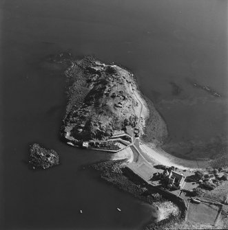 Oblique aerial view centred on the coast batteries with abbey adjacent, taken from the NW.