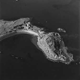 Oblique aerial view centred on the abbey with coast batteries adjacent, taken from the SE.