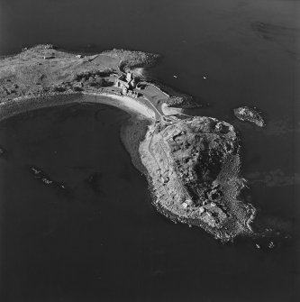 Oblique aerial view centred on the abbey with coast batteries adjacent, taken from the SSE.