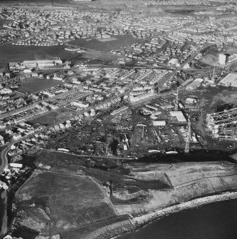 Aerial view from South of offshore construction yard and Methil.  Includes White Swan Hotel.