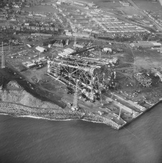 Aerial view from South East of oil platform jacket under construction and Denbeath, Methil.