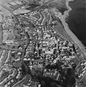 Oblique aerial view of Dysart centred on the village housing redevelopment designed by Wheeler and Sproson in 1958-71, and recorded as part of the Wheeler and Sproson Project and a Threatened Building Survey completed in 1997.  Taken from the SSW.
