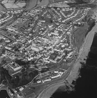 Oblique aerial view of Dysart centred on the village housing redevelopment designed by Wheeler and Sproson in 1958-71, and recorded as part of the Wheeler and Sproson Project and a Threatened Building Survey completed in 1997.  Taken from the S.