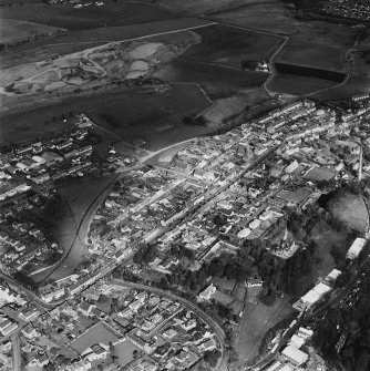 Oblique aerial view of Leslie centred on the village housing development designed by Wheeler and Sproson in 1952-56, and recorded as part of the Wheeler and Sproson Project.  Taken from the SW.