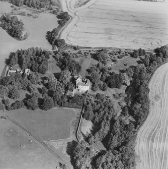 Oblique aerial view centred on the tower-house, taken from the SW.