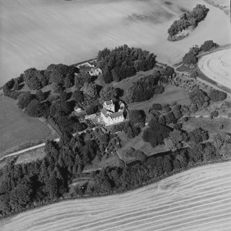 Oblique aerial view centred on the tower-house, taken from the SSE.