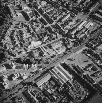 Oblique aerial view centred on the electricity substation with the works adjacent, taken from the N.