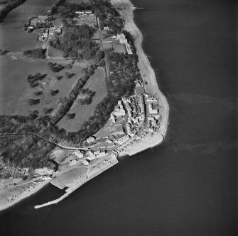 General aerial view of West Wemyss, including Wemyss church, Wemyss harbour, the Coxstool houses and Wemyss Castle, taken from the SW.