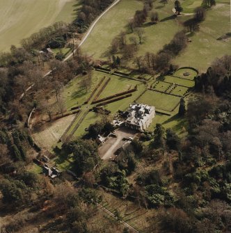 Oblique aerial view of Charleton House centred on a country house, taken from the NW.