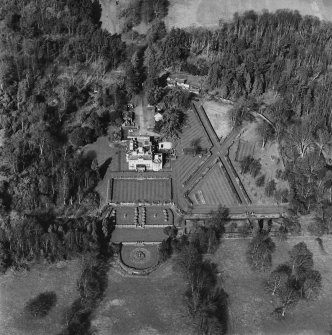 Oblique aerial view of Charleton House centred on a country house, taken from the SE.