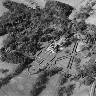 Oblique aerial view of Charleton House centred on a country house, taken from the E.