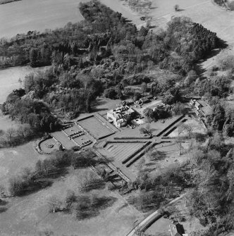 Oblique aerial view of Charleton House centred on a country house, taken from the NE.