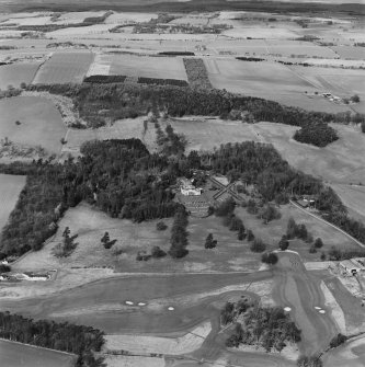 Distant oblique aerial view of Charleton House centred on a country house, taken from the SE.