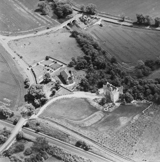 Oblique aerial view of Dairsie Castle and Dairsie Old Church centred on the castle and church, taken from the WNW.