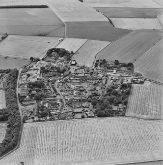 Oblique aerial view centred on the village of Kingsbarns, taken from the NE.