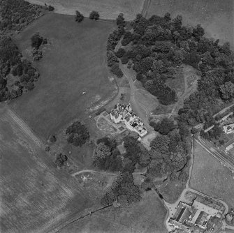 Oblique aerial view centred on the country house, taken from the SSW.