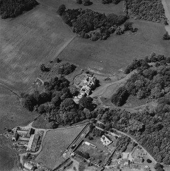 Oblique aerial view centred on the country house, taken from the SE.