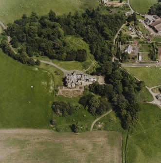 Oblique aerial view centred on the country house, taken from the SW.