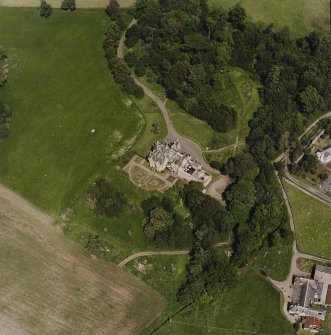 Oblique aerial view centred on the country house, taken from the SW.