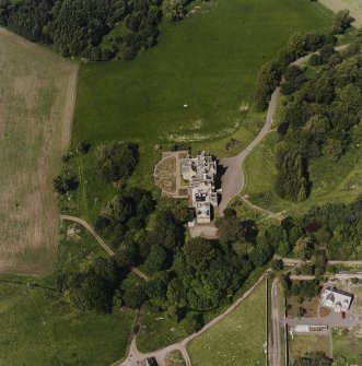 Oblique aerial view centred on the country house, taken from the S.