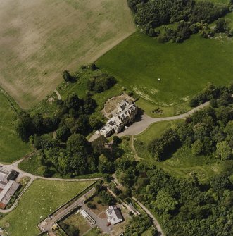 Oblique aerial view centred on the country house, taken from the SE.