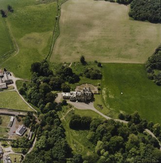 Oblique aerial view centred on the country house, taken from the E.