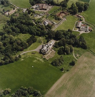 Oblique aerial view centred on the country house, taken from the NW.