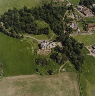 Oblique aerial view centred on the country house, taken from the SW.