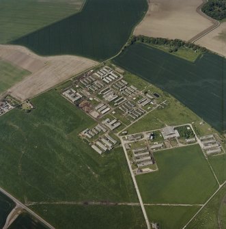 Oblique aerial view centred on the remains of the military camp, taken from the E.