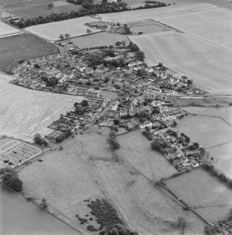 Oblique aerial view centred on the village of Upper Largo with walled garden adjacent, taken from the NW.