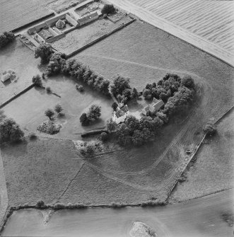Oblique aerial view centred on Pitcullo castle with dovecot adjacent, taken from the NE.